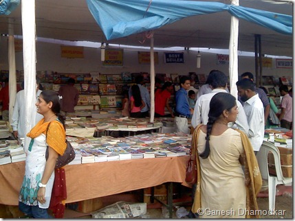 People enjoying going through books at National Book Fair Nagpur.  This fair has become an integral part of reading culture in Nagpur over the years.